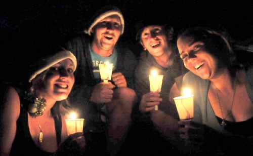 CHRISTMAS JOY: Carols by Candlelight devotees Ali Oakes, Blake Woodgate, Brett Collins and Chloe Epple at Saturday nights celebrations. CHRISTMAS JOY: Carols by Candlelight devotees Ali Oakes, Blake Woodgate, Brett Collins and Chloe Epple at Saturday nights celebrations.